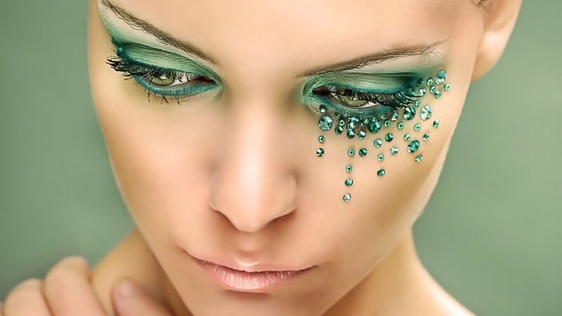 green eye makeup with gems