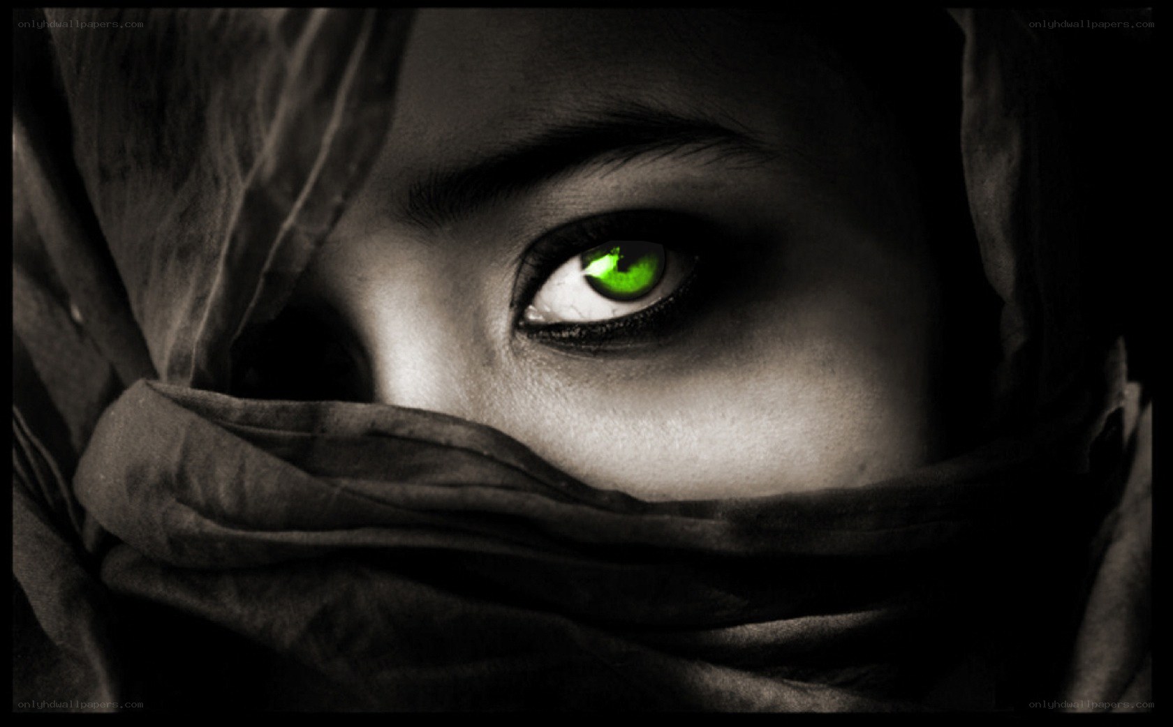 green-eyed figure in shadow