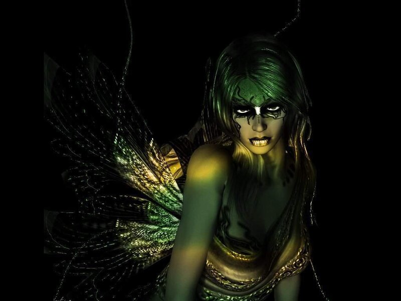 green fairy with glowing wings