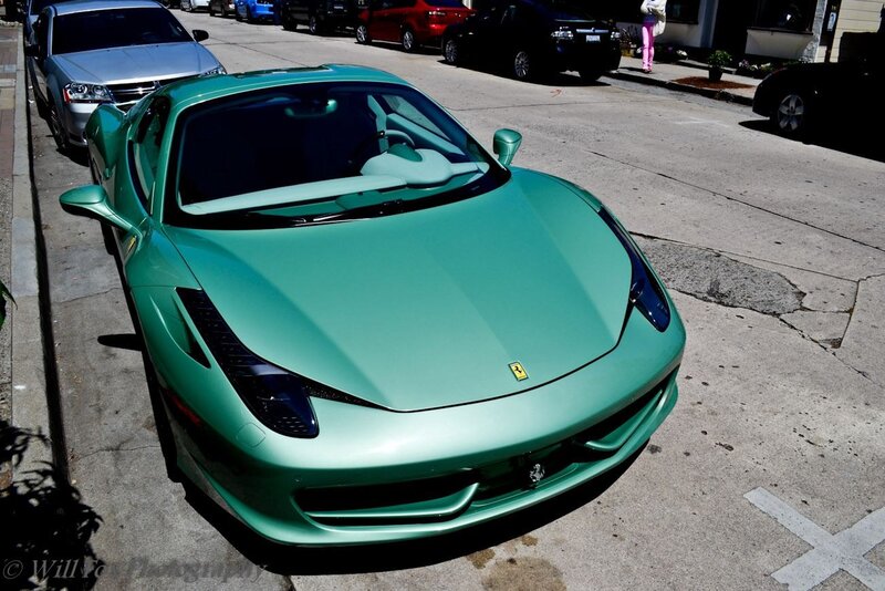 green ferrari on street