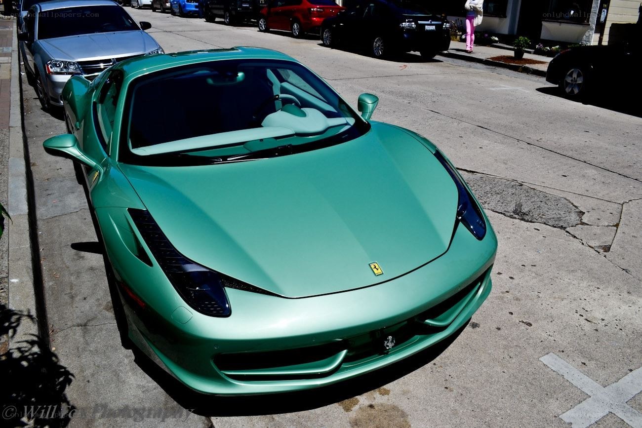 green ferrari on street