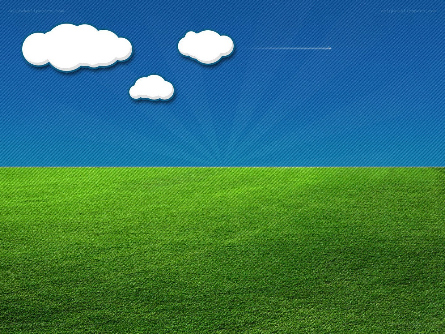 green field under blue sky