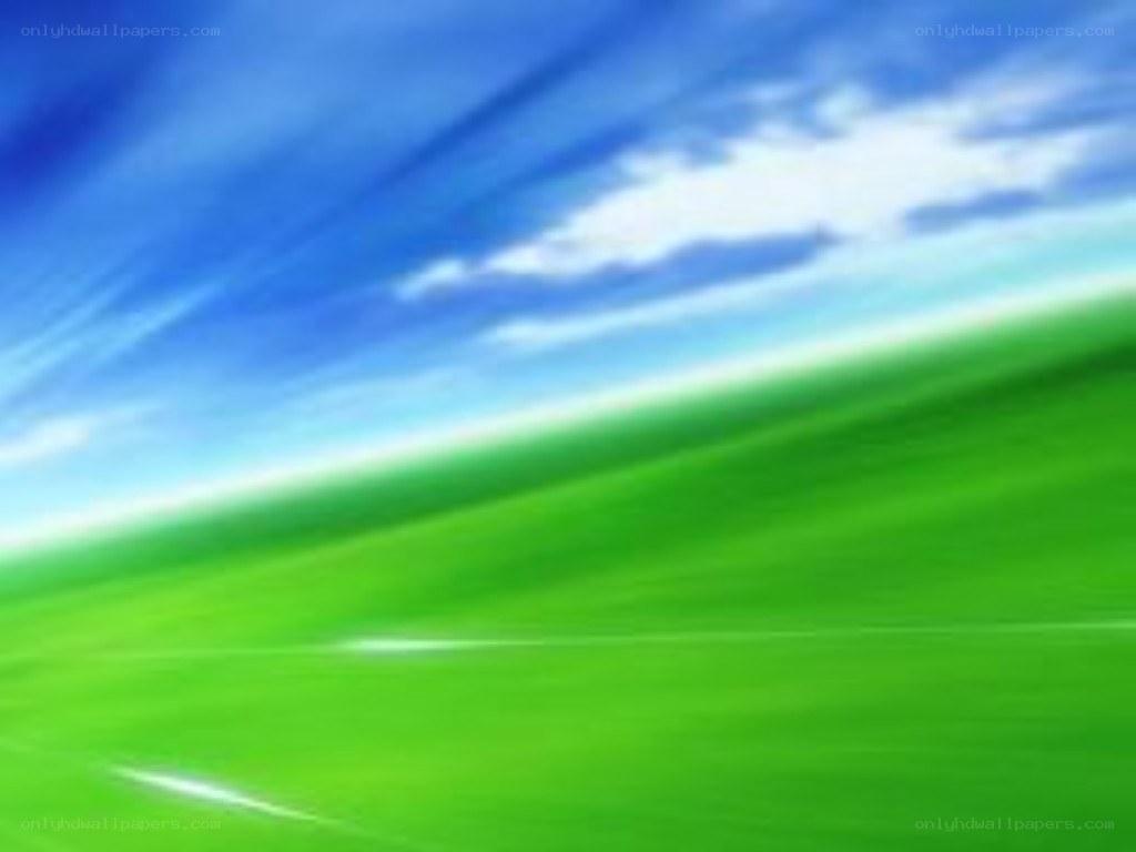 green field under blue sky