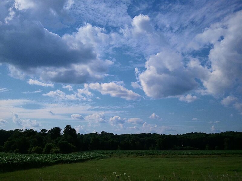 Green Field under Cloudy Sky — Blue, Serene, Afternoon