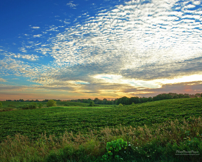 Green Field under Cloudy Sky — Blue, Serene, Sunset