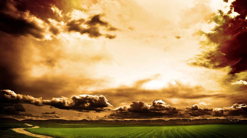 Green Field under Cloudy Sky — Dramatic, Sunset, Photograph, Mountains