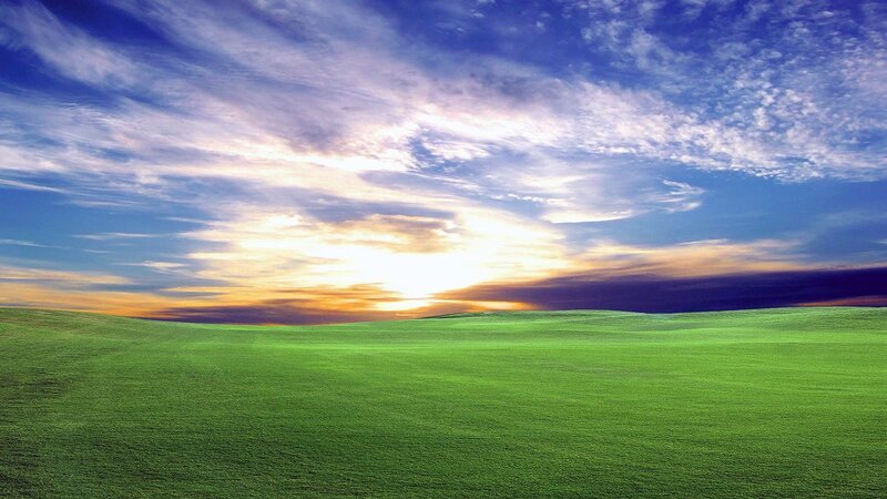 Green Field under Sky — Serene, Sunset, Photograph, Clouds, Sun