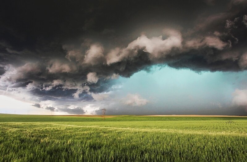 Green Field under Storm Clouds — Dramatic, Afternoon, Photograph, Power Lines