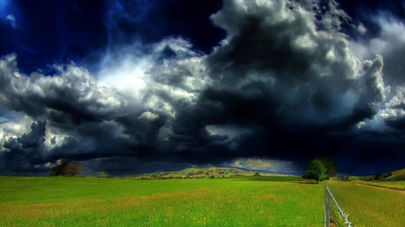 Green Field under Storm Clouds — Dramatic, Afternoon, Photograph