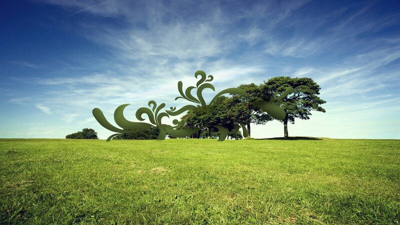 Green field with abstract sculpture