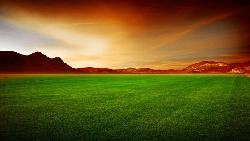 Green Field with Mountains — Dramatic, Sunset, Photograph, Sky