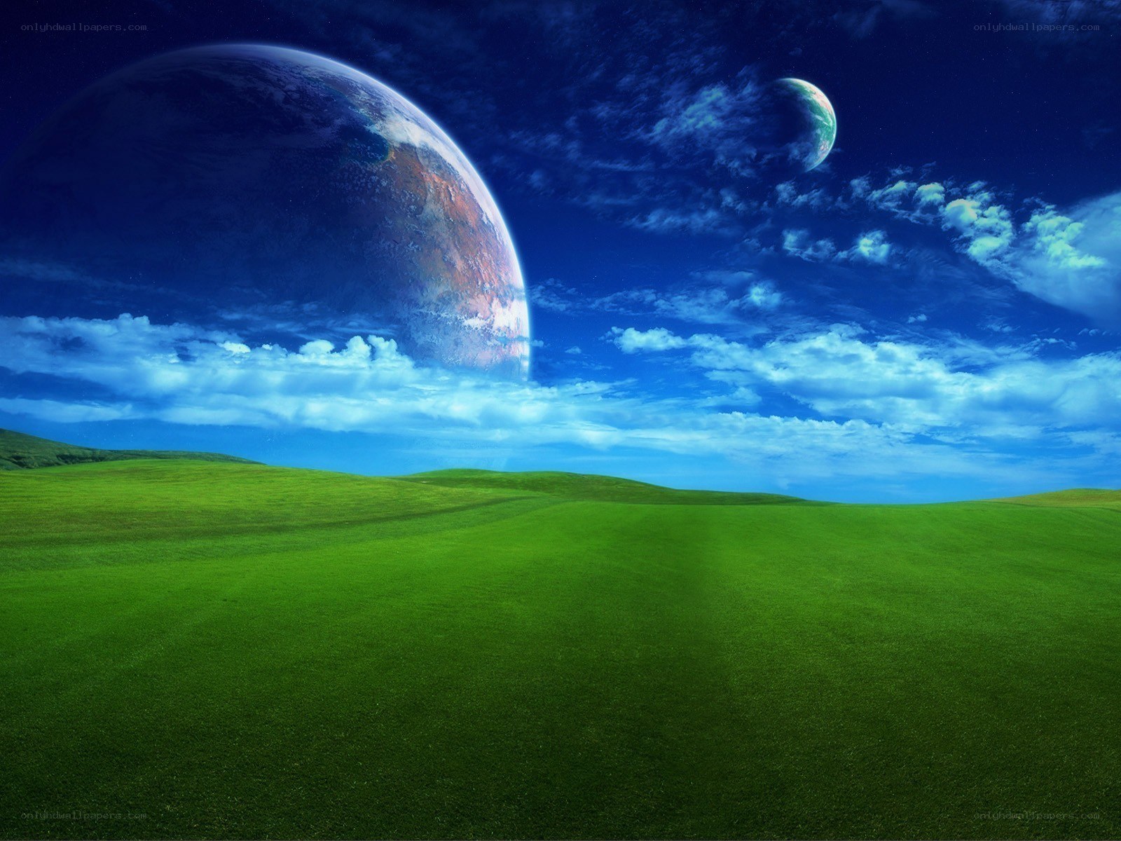 Green field with planets