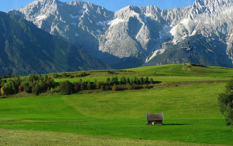 Green fields with mountain backdrop