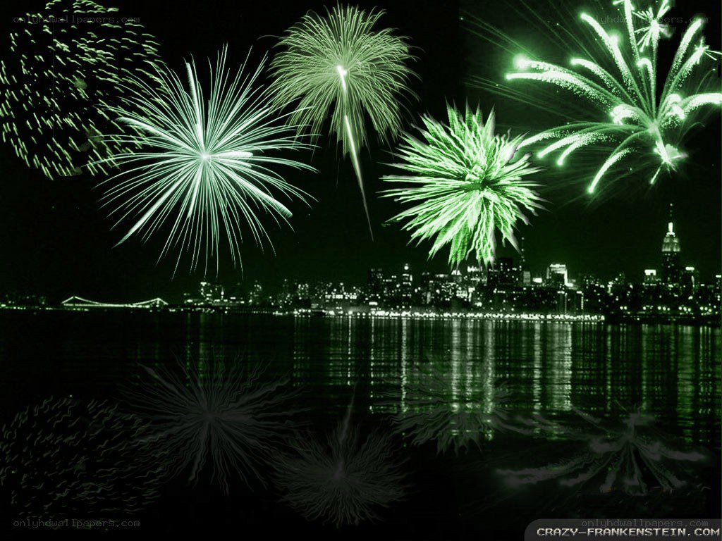 Green fireworks over city