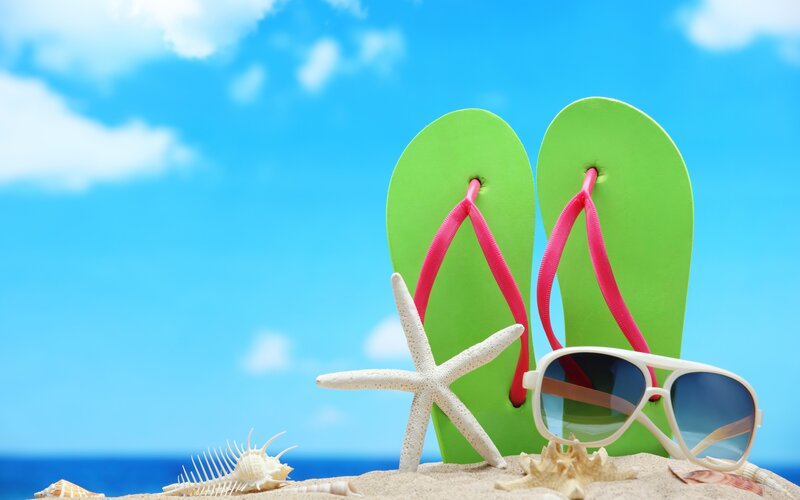 Green Flip-flops on Sand