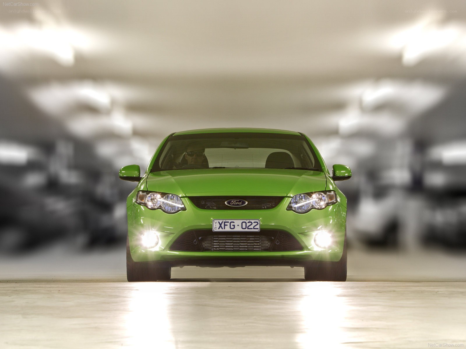 green ford falcon in parking garage