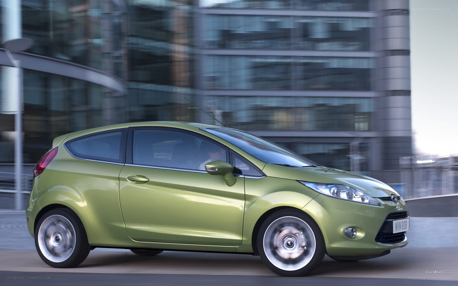 green ford fiesta in motion