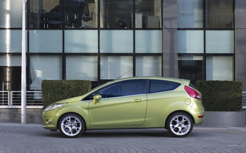 green ford fiesta parked outside
