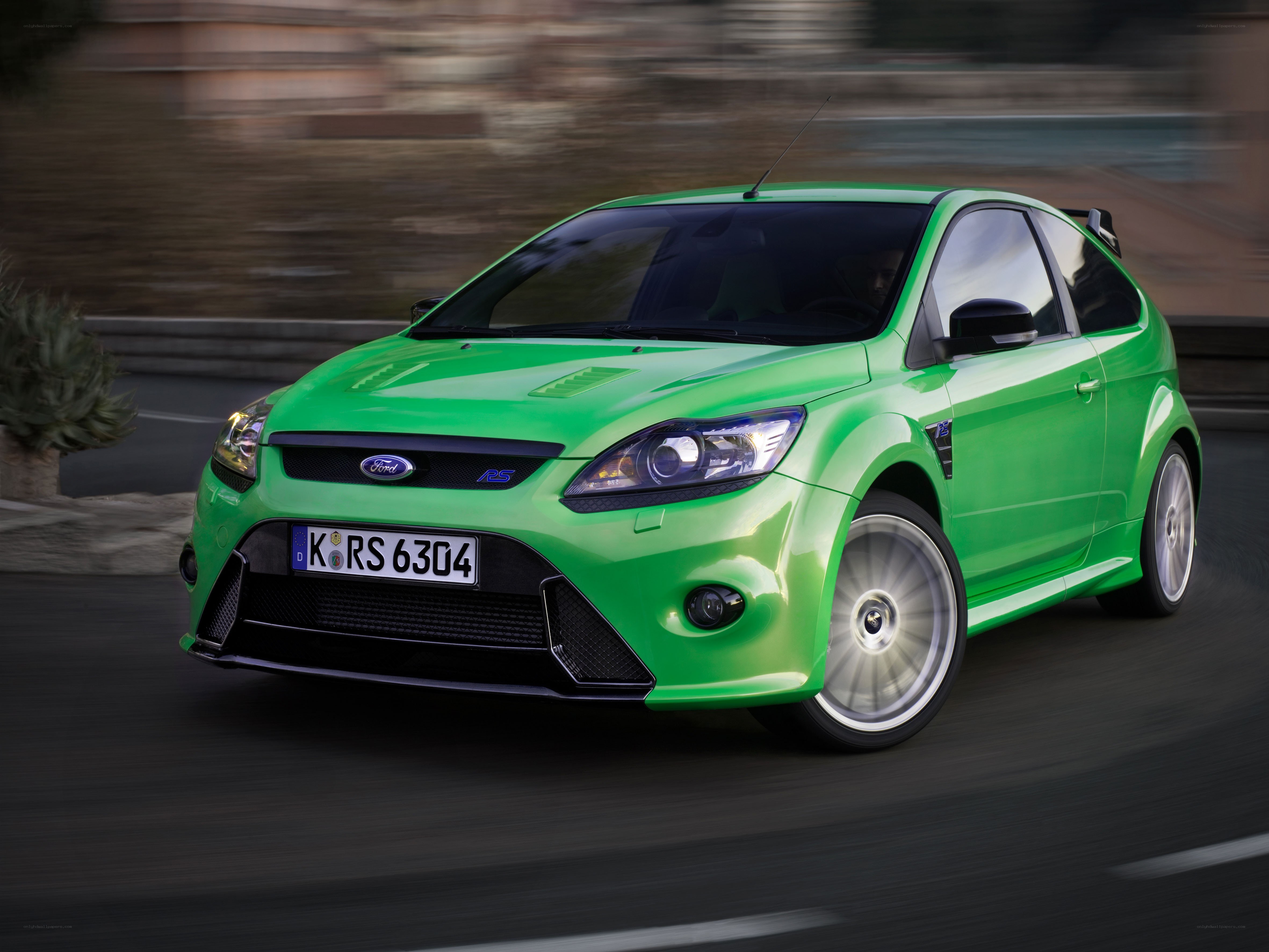 Green Ford Focus RS in motion