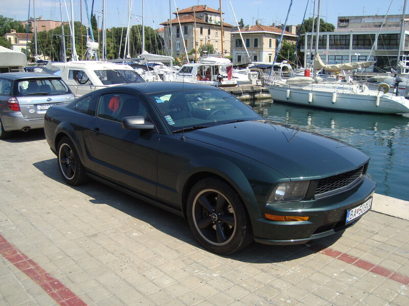 Green Ford Mustang at marina