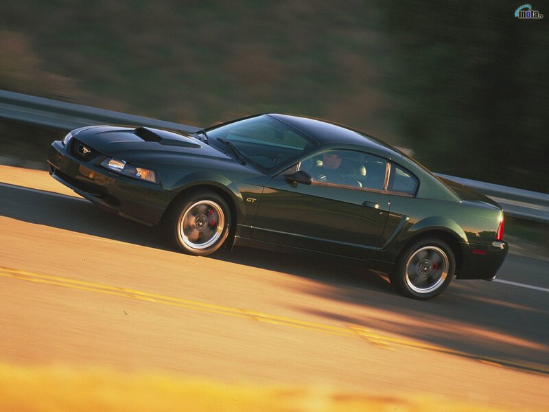 Green Ford Mustang GT in motion