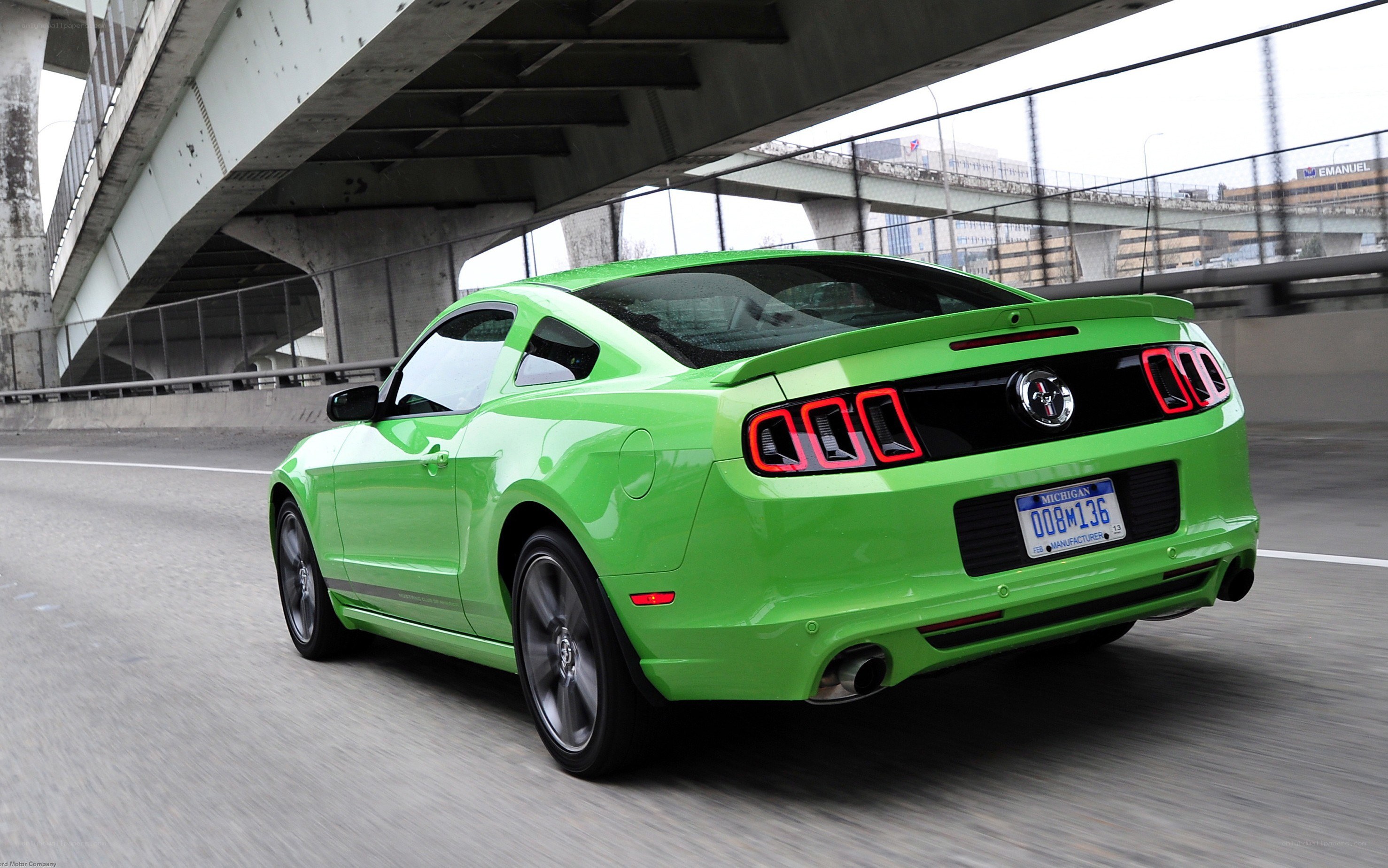 green ford mustang on highway