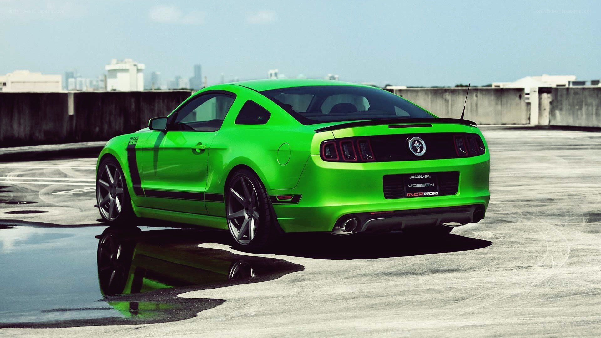 green ford mustang on rooftop