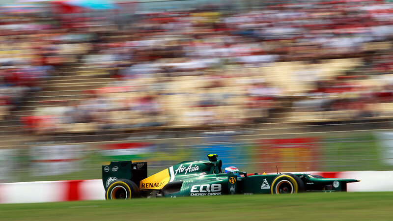 Green Formula One Car — Dynamic, Afternoon, Photograph, Driver, Crowd