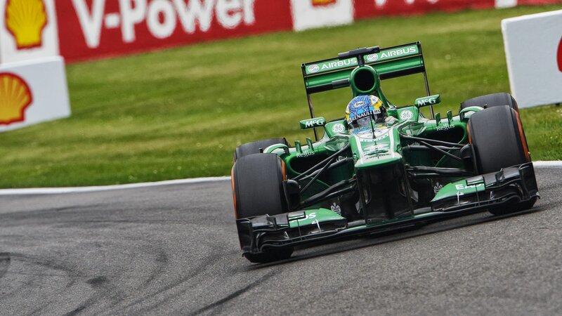 Green Formula One Car — Dynamic, Afternoon, Photograph, Driver, Grass
