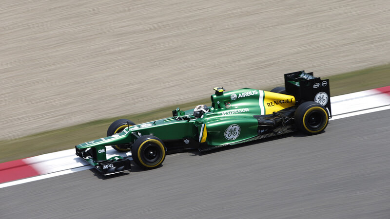 Green Formula One Car — Dynamic, Afternoon, Photograph, Driver, Racetrack