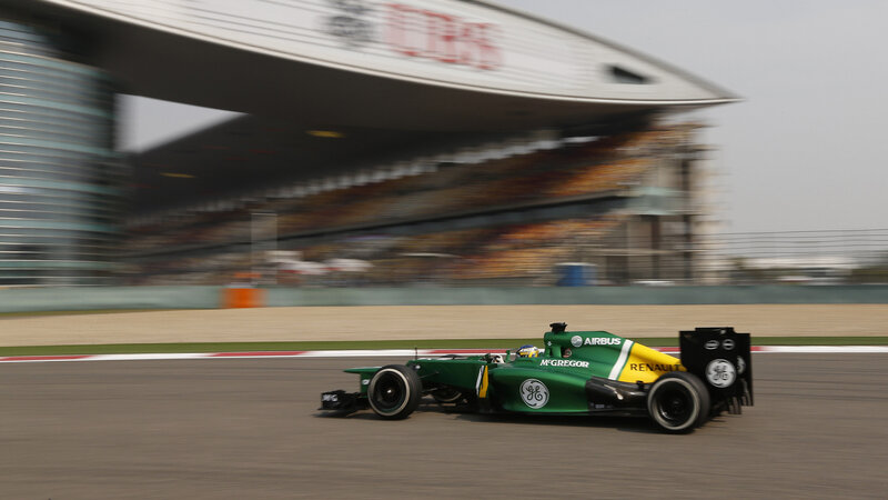 Green Formula One Car — Dynamic, Afternoon, Photograph, Race Track, Grandstand