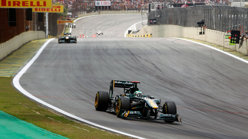 Green Formula One Car — Dynamic, Afternoon, Photograph, Race Track