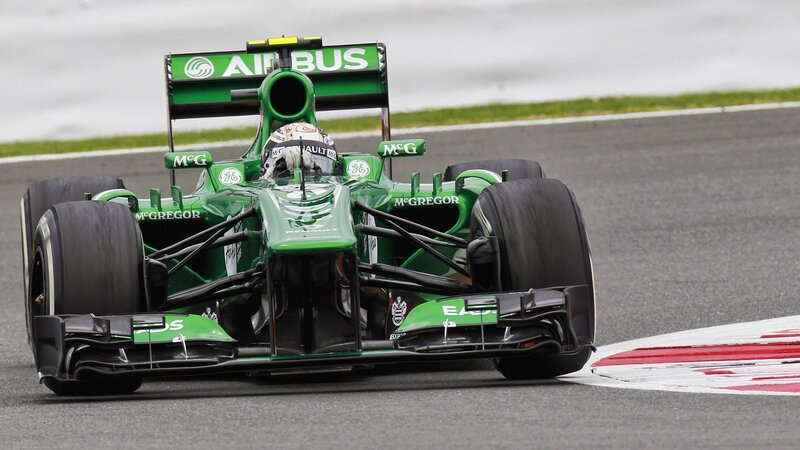 Green Formula One Car — Dynamic, Photograph, Driver, Race Track, Grass