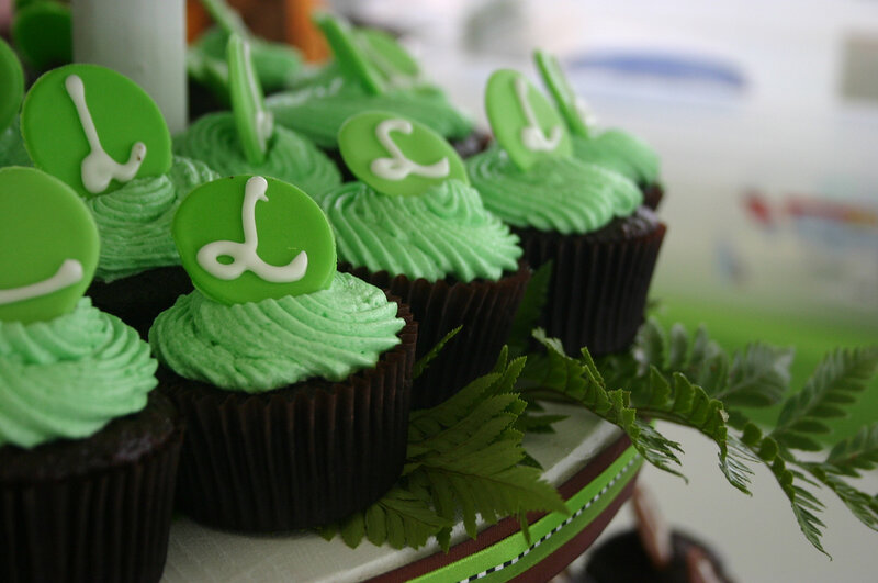 Green-frosted cupcakes with decorations