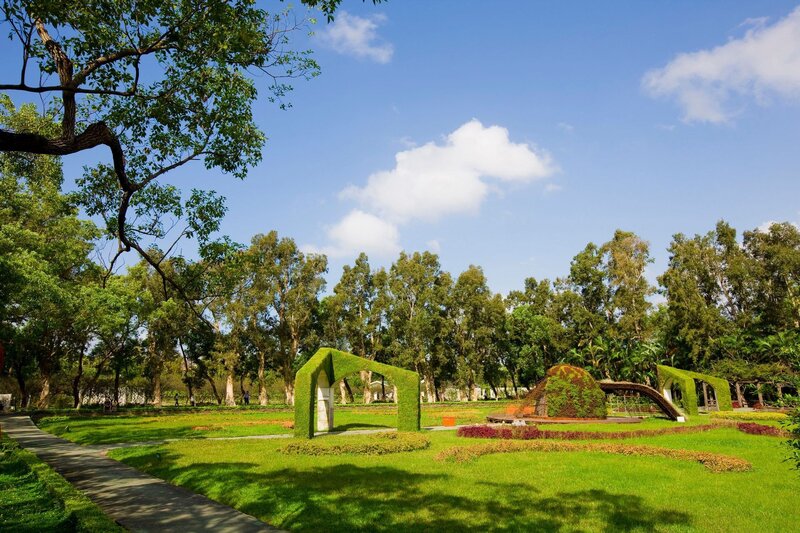 green garden with topiary arches