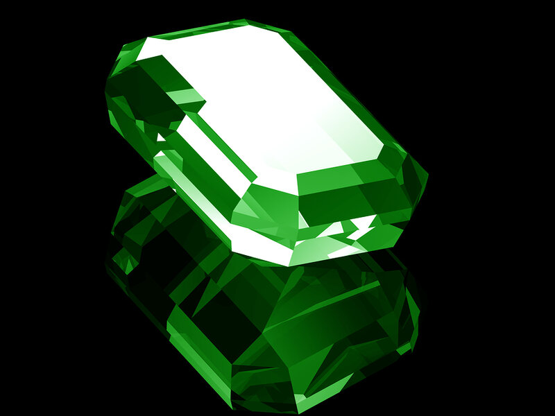 green gemstone with reflection