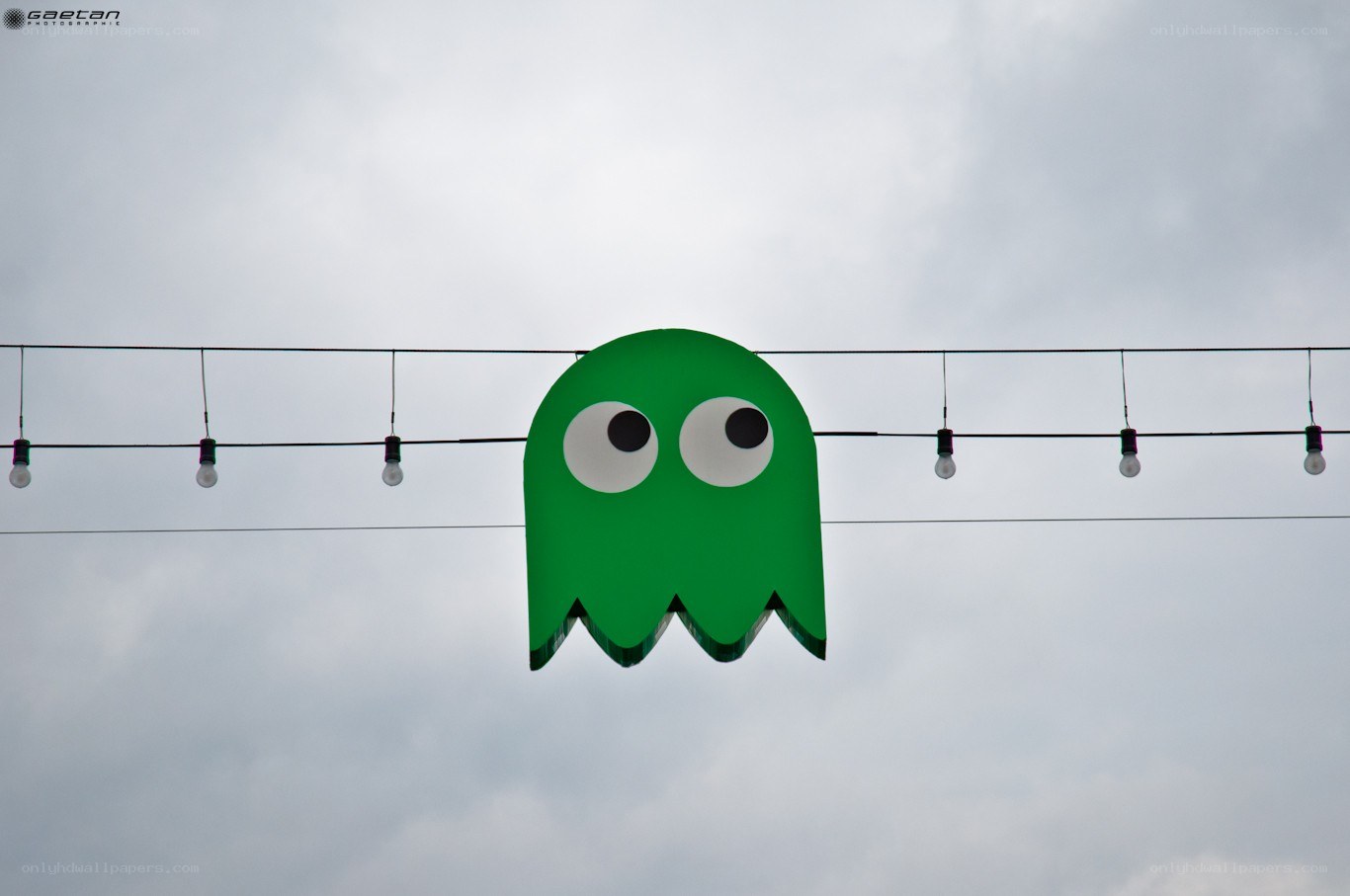 Green ghost decoration on string lights