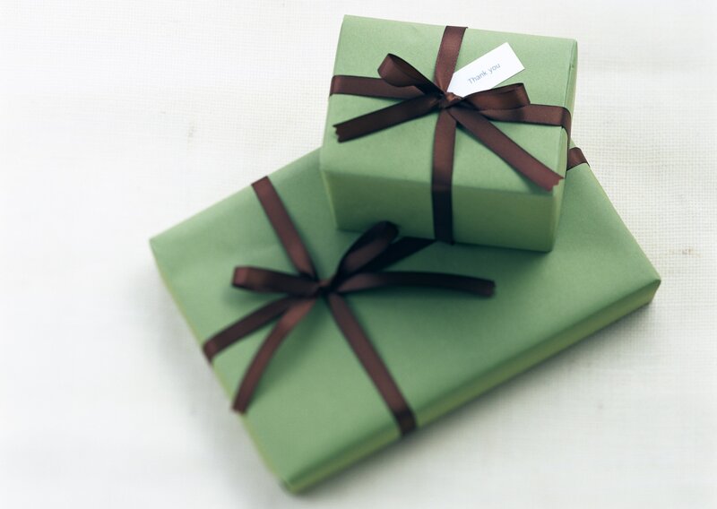 green gifts with brown ribbons