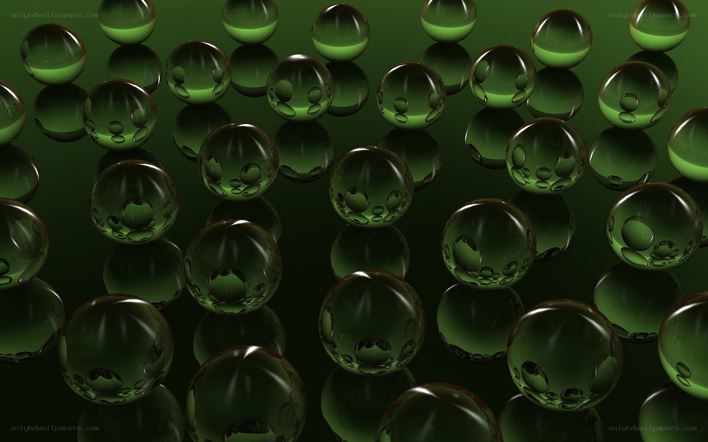 green glass spheres on reflective surface