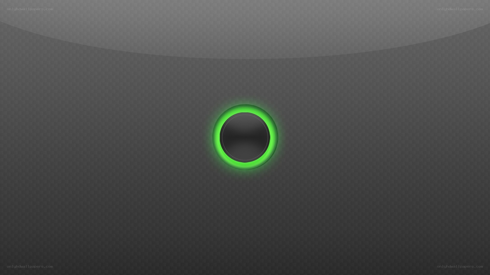 green glowing button on dark surface