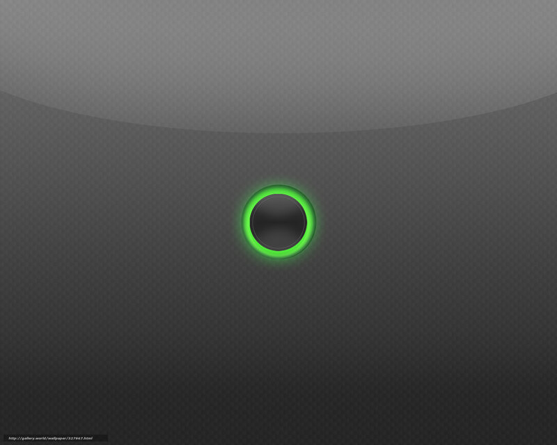 green glowing button on dark surface