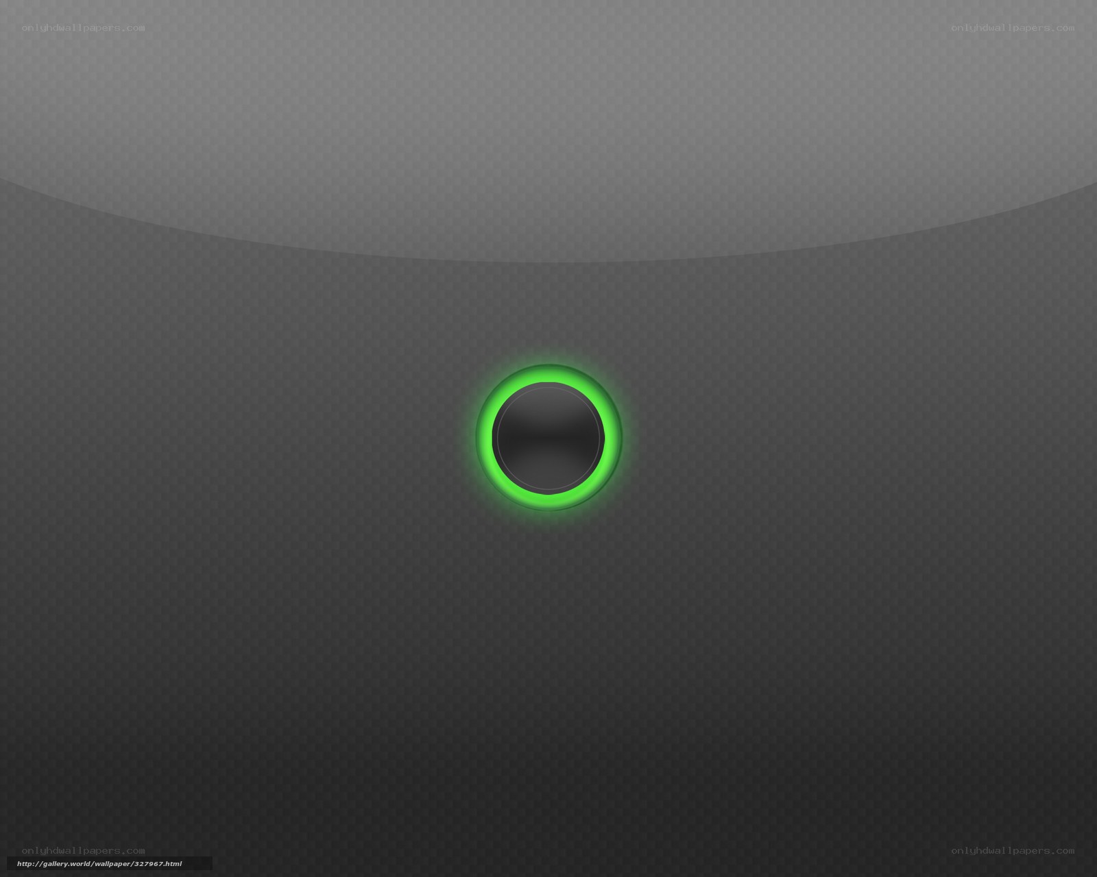 green glowing button on dark surface
