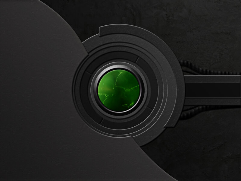 green glowing lens on dark surface