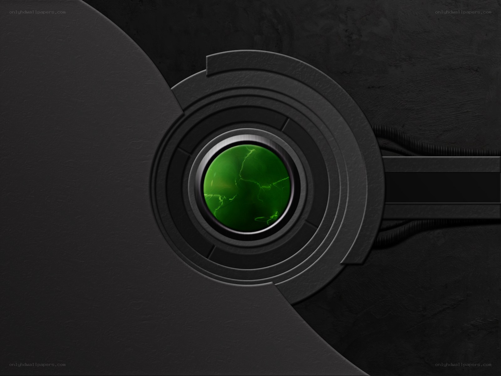 green glowing lens on dark surface