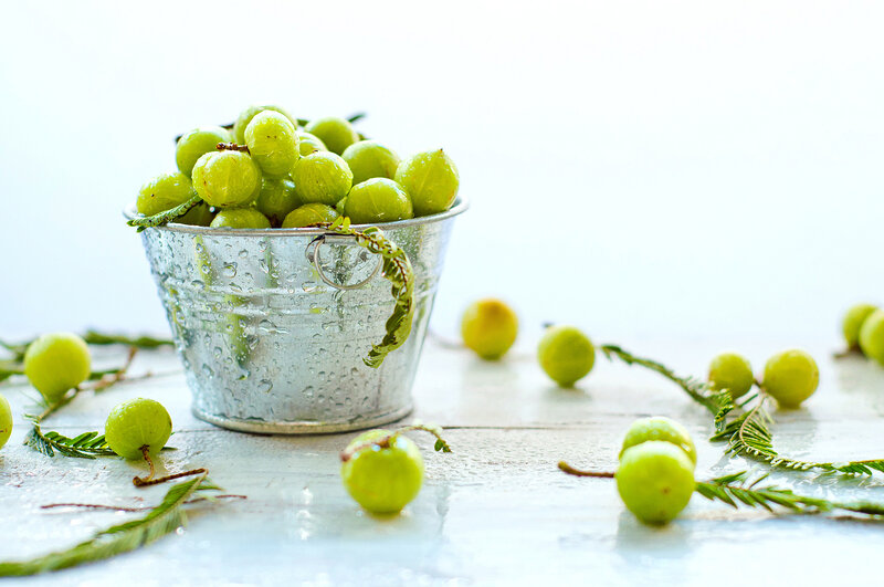 Green Gooseberries in Bucket