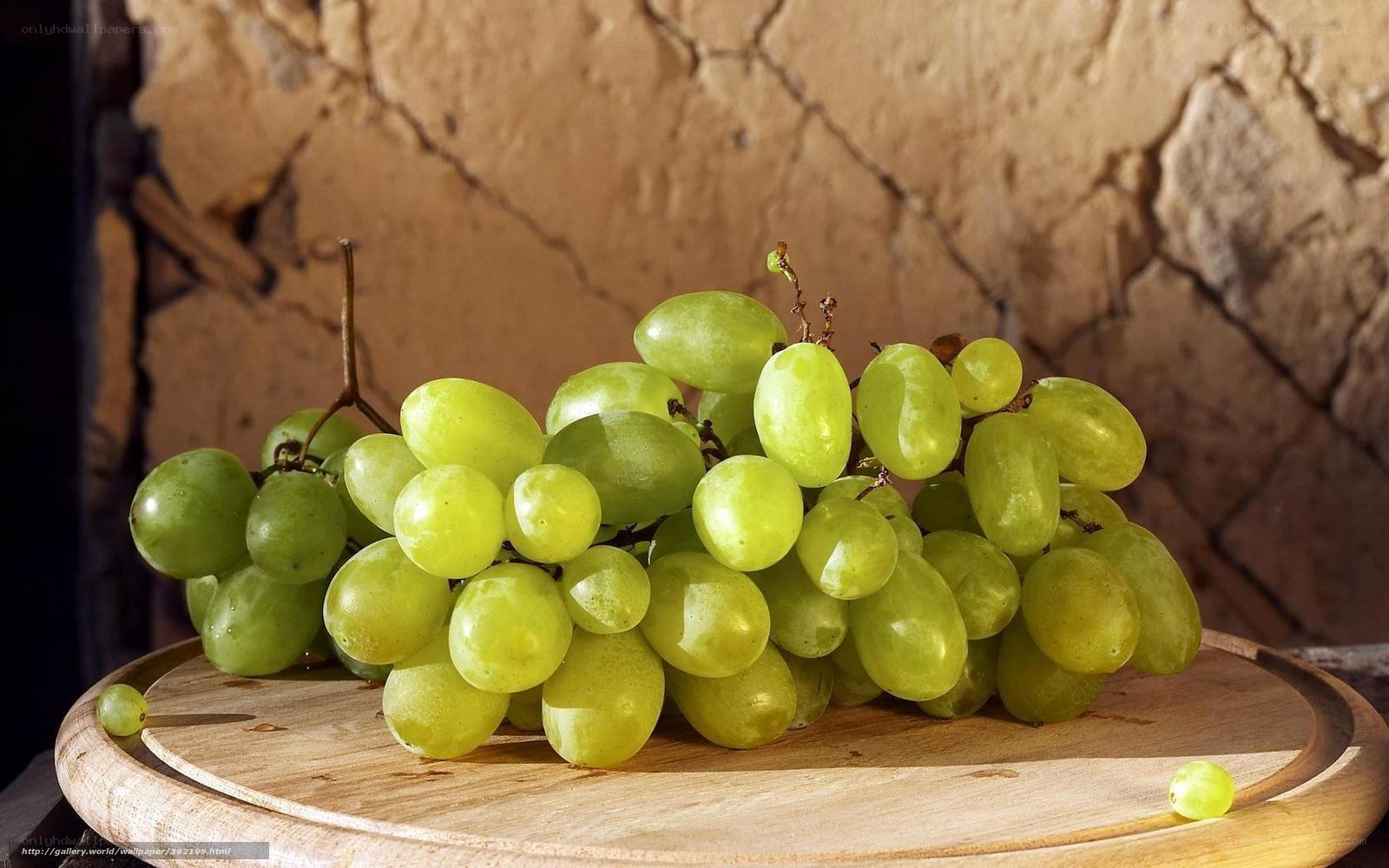 green grapes on wooden board