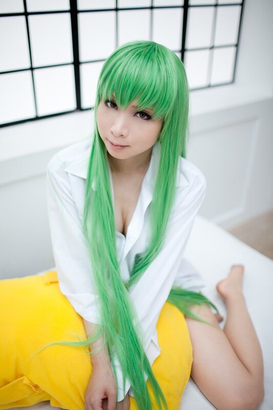 green-haired cosplayer in white shirt
