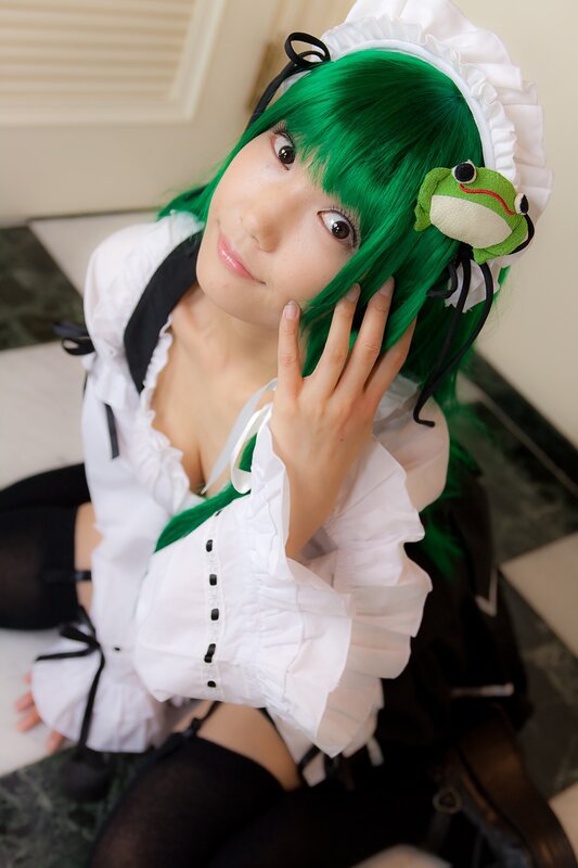 green-haired cosplayer with frog accessory