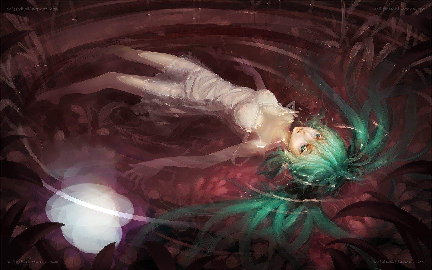 green-haired girl floating underwater