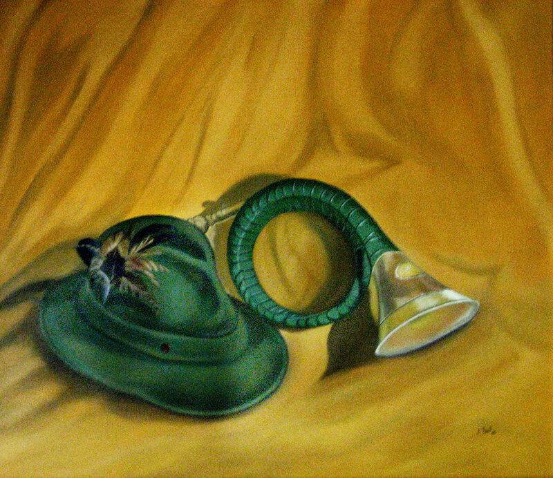 green hat and horn on yellow cloth